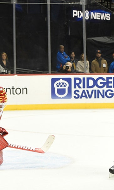 Hickey's OT goal helps Isles stay strong at home vs Flames
